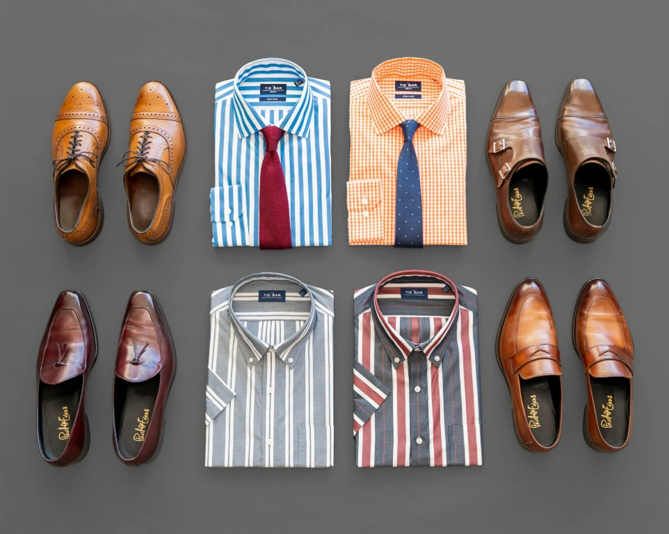 brown leather shoes beside red and white striped socks